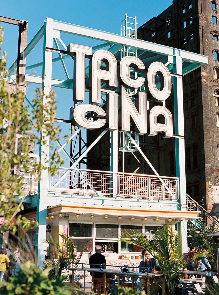 Sign for an outdoor restaurant in Williamsburg, Brooklyn, NY reading "Tacocina."