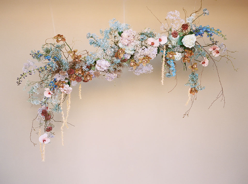 Colorful hanging floral arrangement designed by Lavenders Flowers for a branding editorial photo shoot. Photographed by California branding photographer Kim Branagan