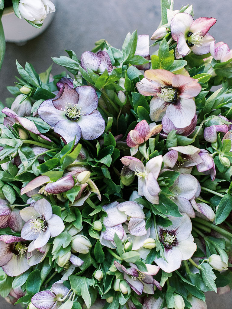 A large bunch of pastel blue and violet flowers being used in a floral workshop by Sweet Root Village and Amy Nicole Floral